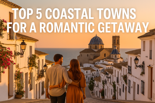 Couple enjoying sunset on a Spanish coastal balcony overlooking the sea, surrounded by Mediterranean rooftops and romantic golden light.