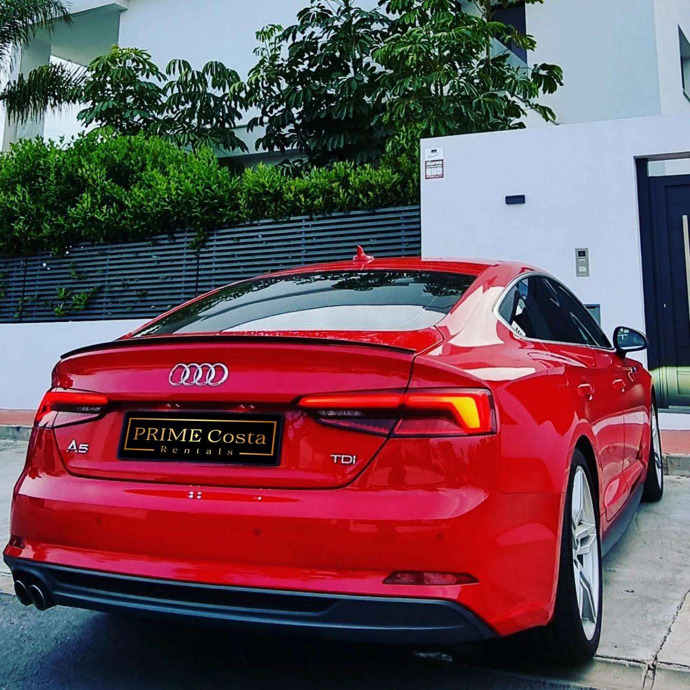 Red Audi A5 TDI S-Line for rent in Marbella – 2.0L diesel, automatic, stylish 5-seat limousine.