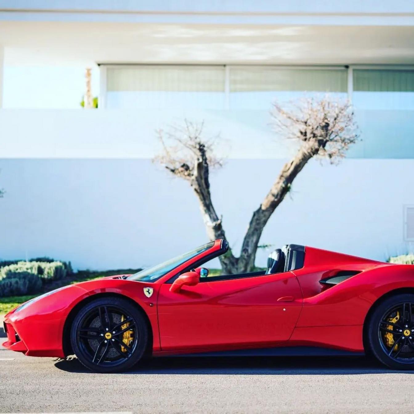 Red Ferrari 488 Spider for rent in Marbella – 720 HP, 3.9L V8 automatic supercar convertible with 2 seats.