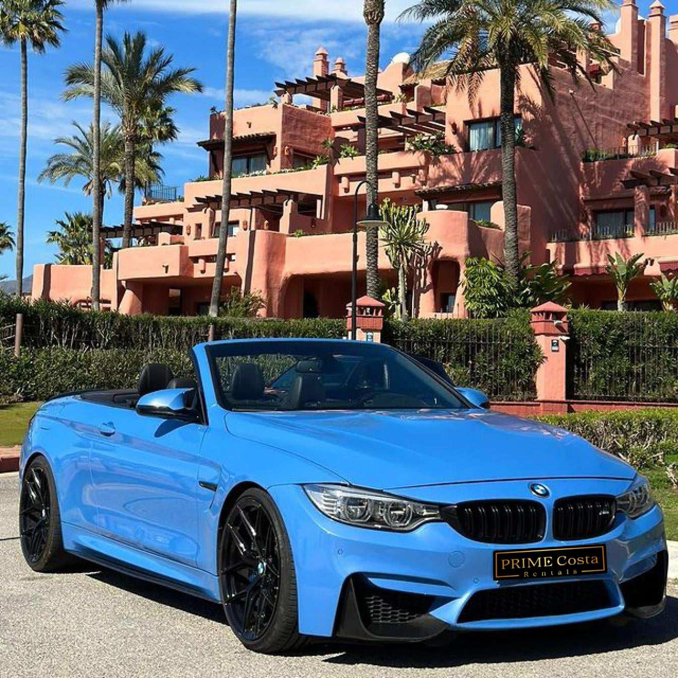 Blue BMW M4 Cabrio for rent in Marbella – automatic 4-seater convertible with sporty M styling.