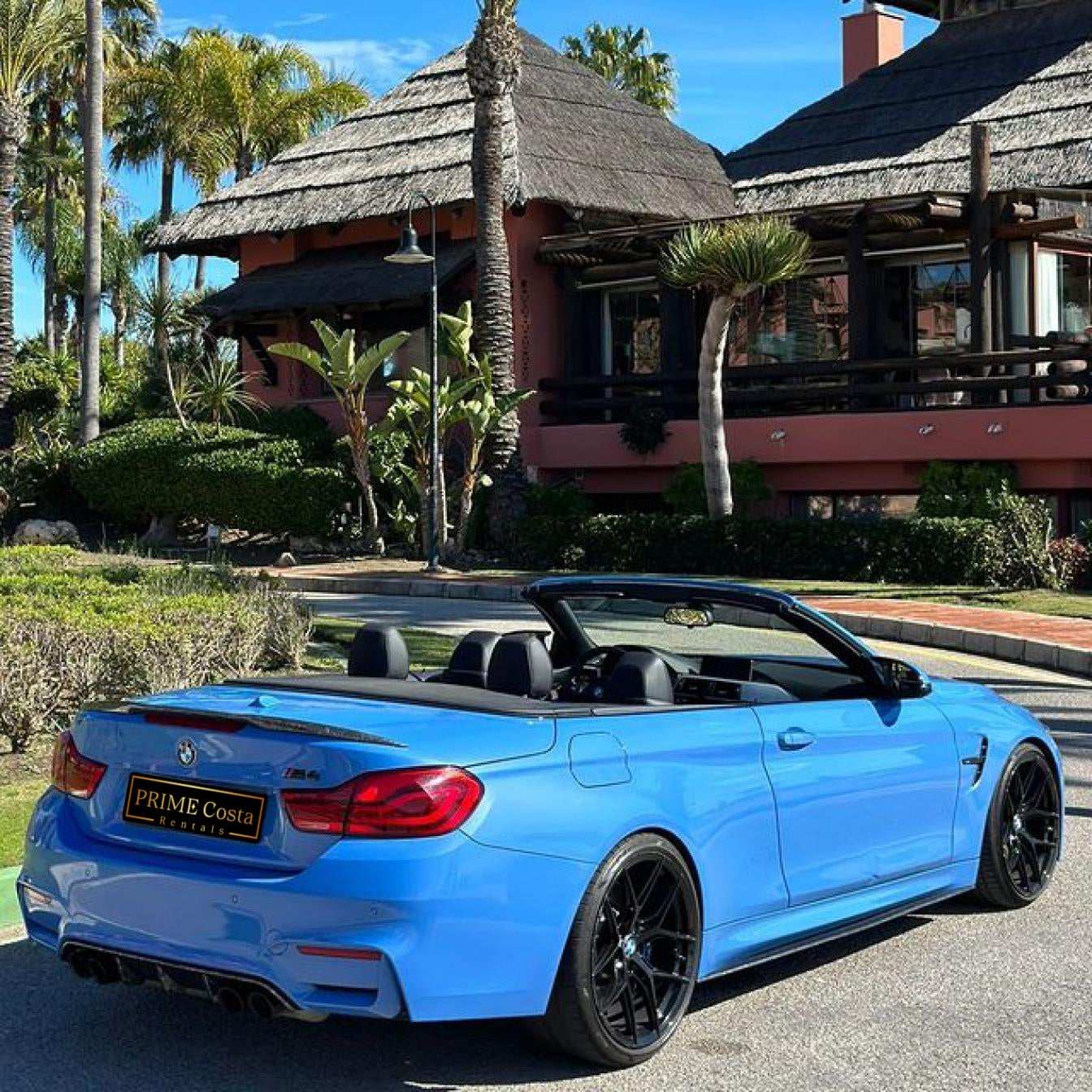 Blue BMW M4 Cabrio for rent in Marbella – automatic 4-seater convertible with sporty M styling.