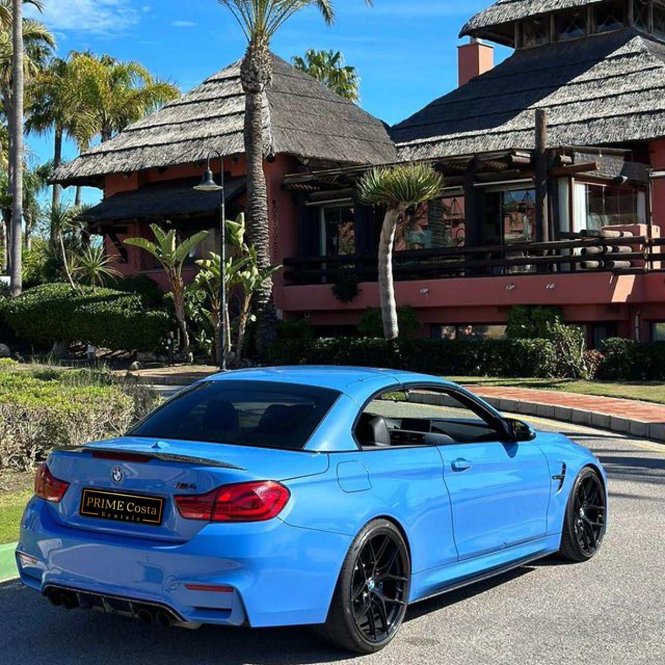 Blue BMW M4 Cabrio for rent in Marbella – automatic 4-seater convertible with sporty M styling.