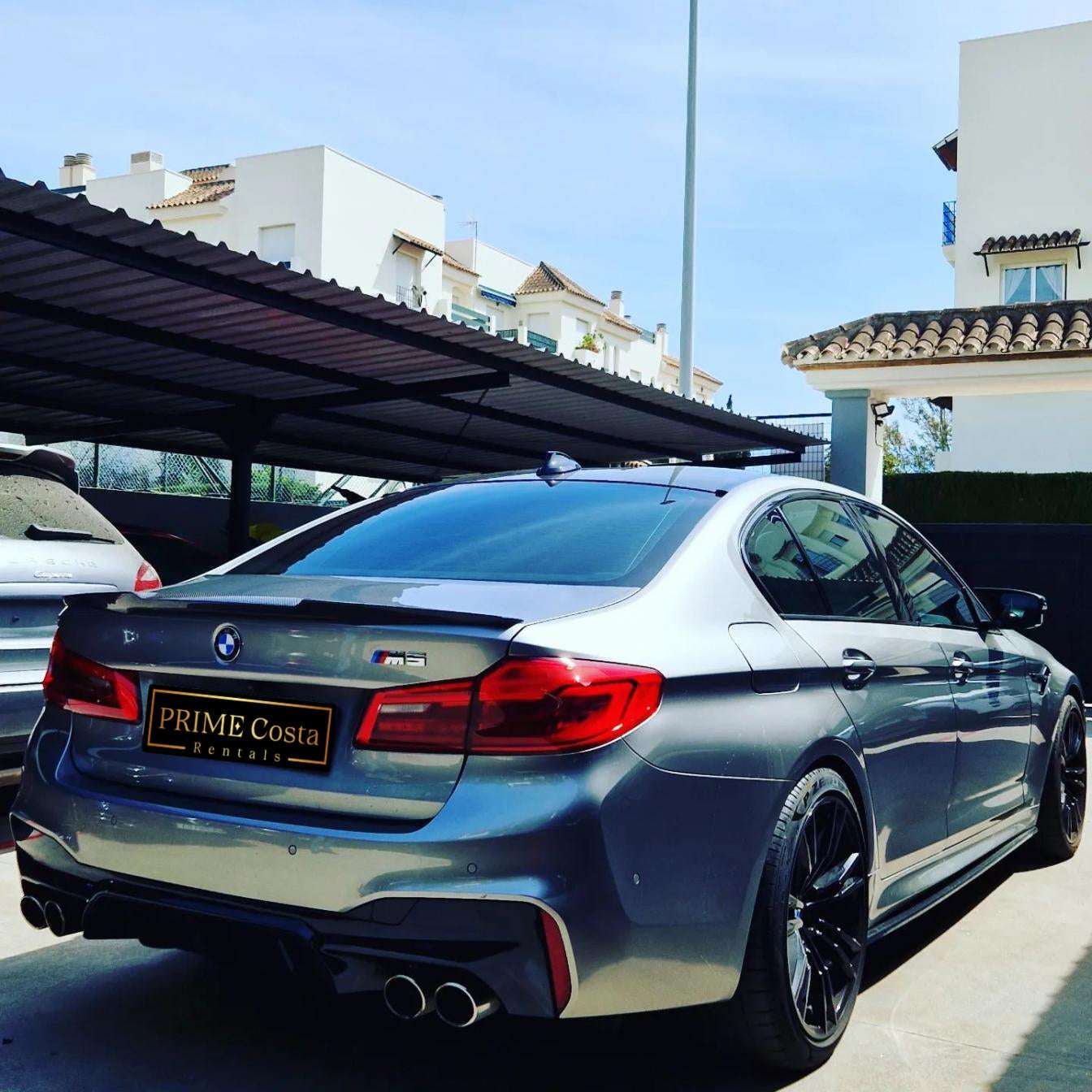 Silver BMW M5 sedan for rent in Marbella – 4.4L automatic, 4WD, 0–100 km/h in 3.4 seconds, top speed 300 km/h.