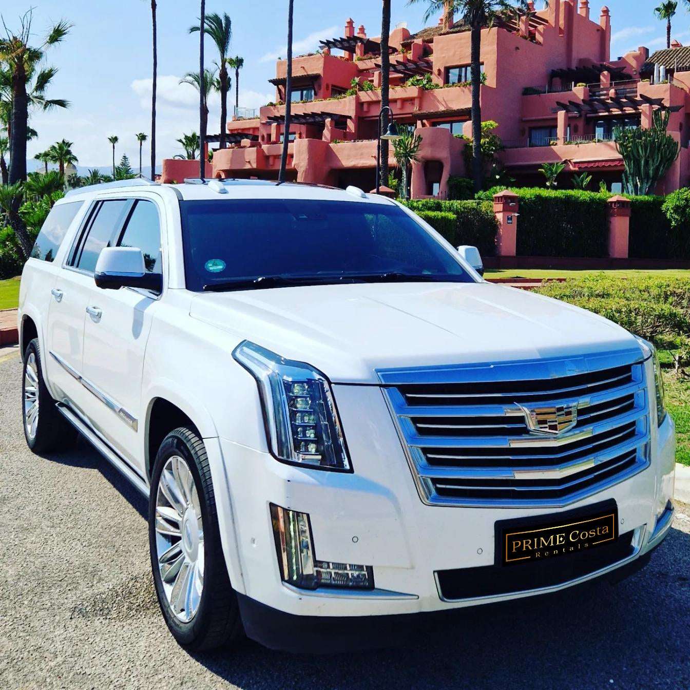 White Cadillac Escalade SUV for rent in Marbella – 6.2L V8, automatic 4WD, 7-seater luxury vehicle.