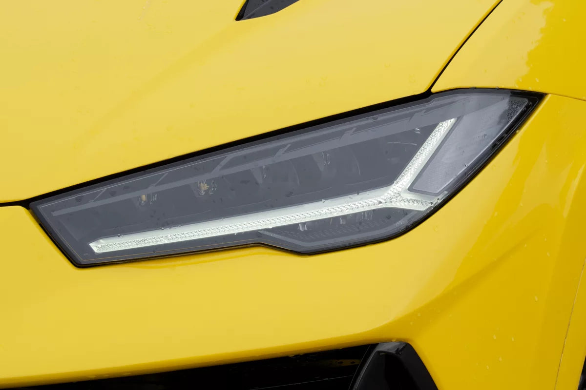 Yellow 2023 Lamborghini Urus S luxury SUV parked in Marbella, available for rent at Prime Costa Rentals.