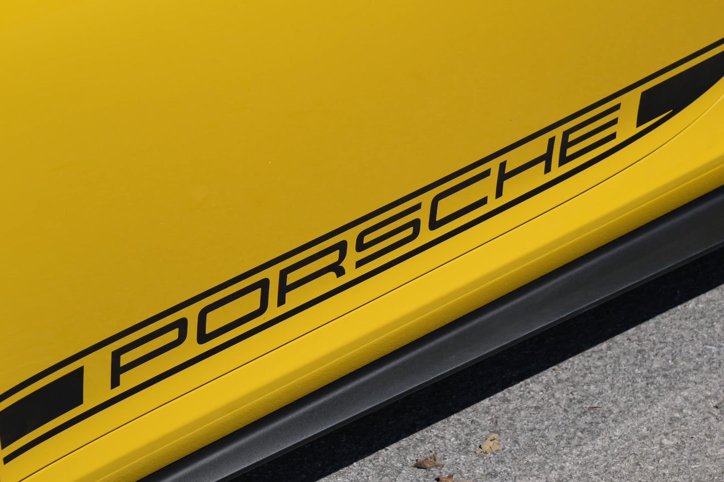 Yellow 2023 Porsche 911 GT3 parked in Marbella, available for rent from Prime Costa Rentals.