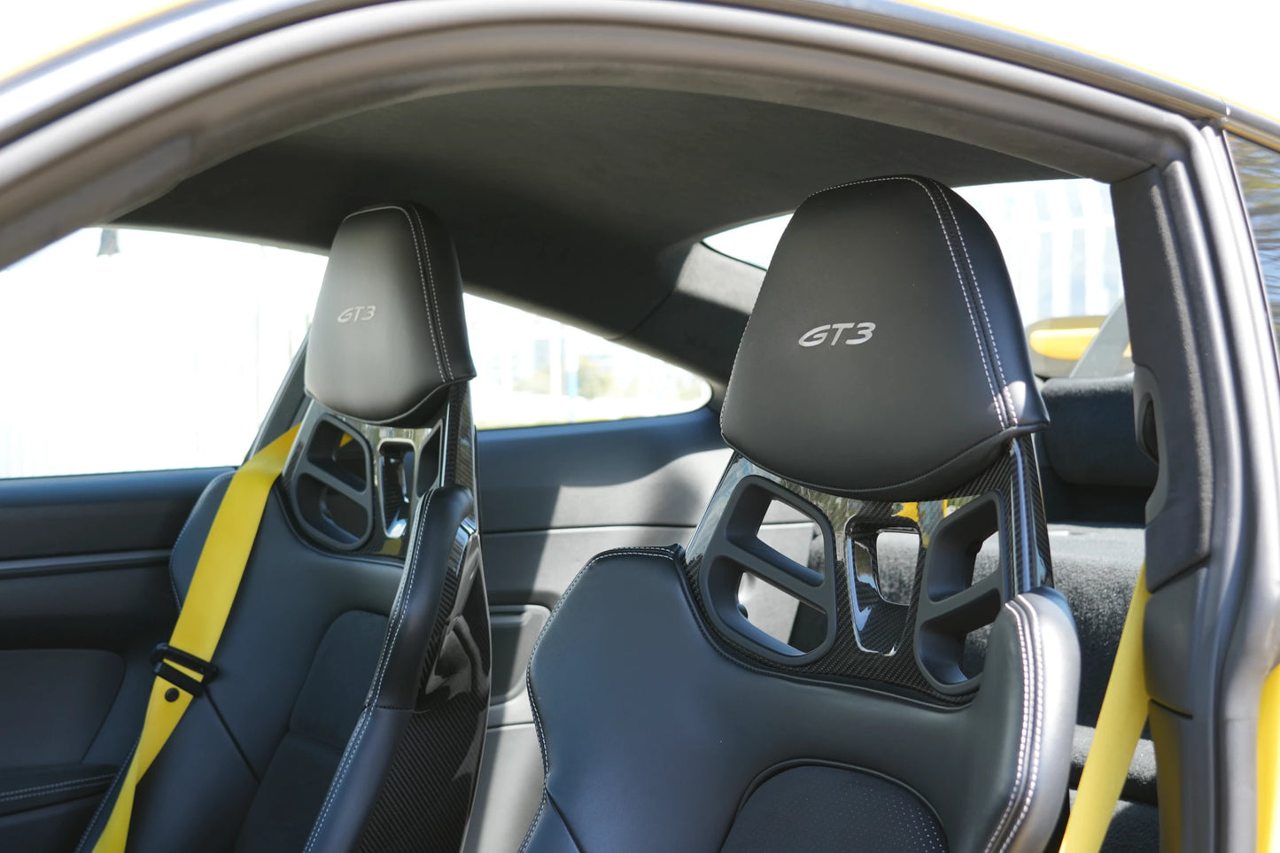 Yellow 2023 Porsche 911 GT3 parked in Marbella, available for rent from Prime Costa Rentals.