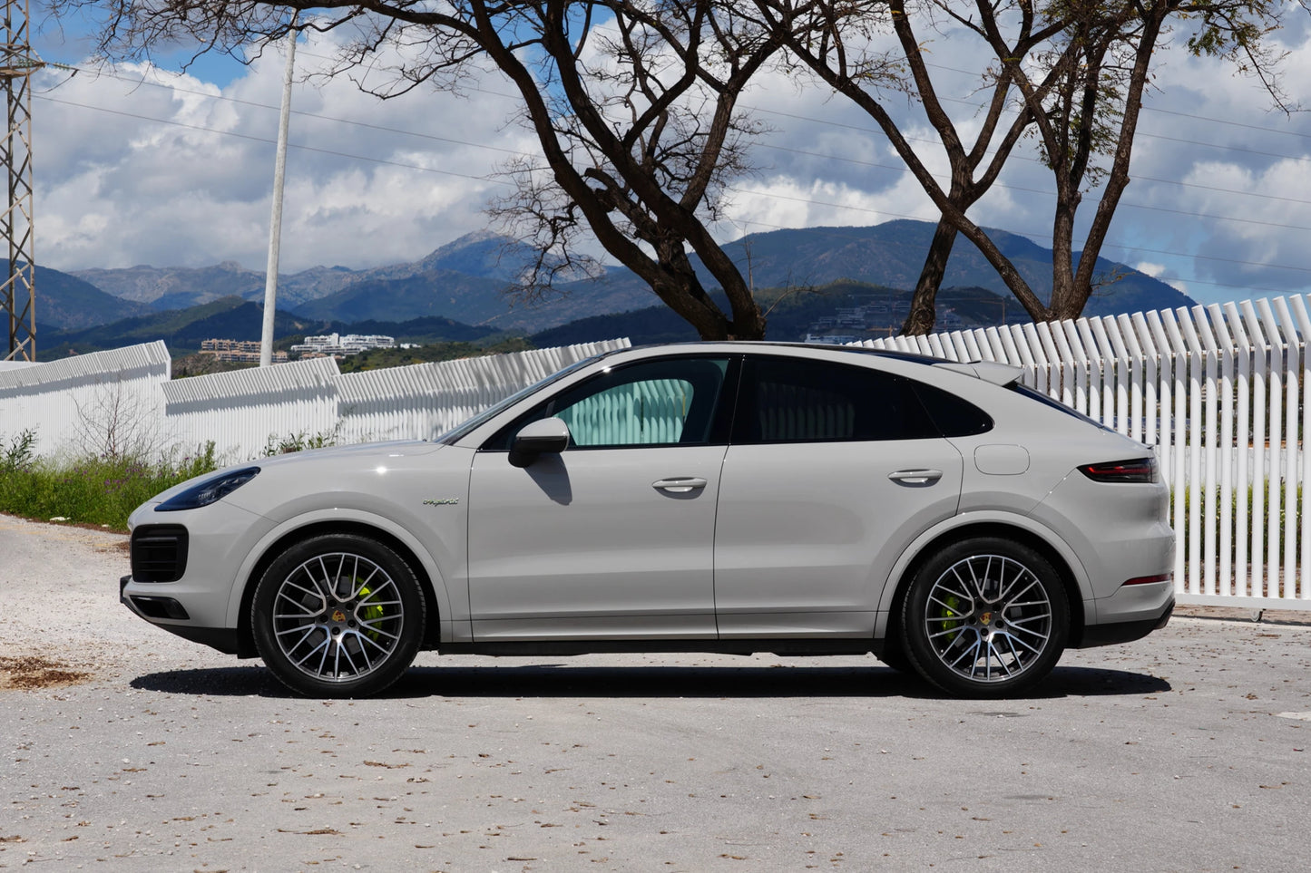 Grey 2023 Porsche Cayenne Coupe E-Hybrid SUV parked in Marbella, available for rent from Prime Costa Rentals.