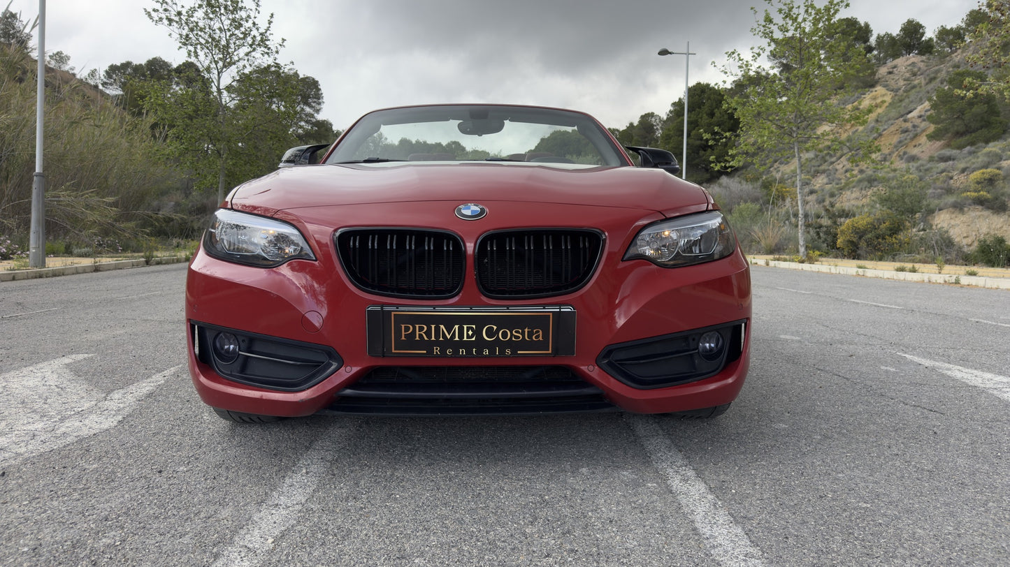 BMW 2 Series Cabrio parked in Benidorm, available for rent with delivery across Spain.