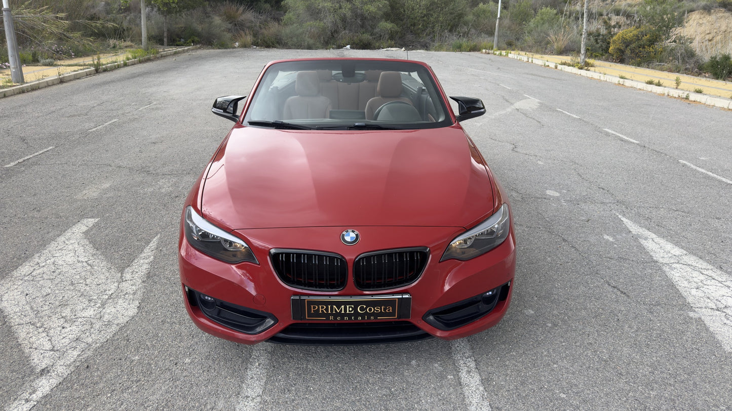 BMW 2 Series Cabrio parked in Benidorm, available for rent with delivery across Spain.