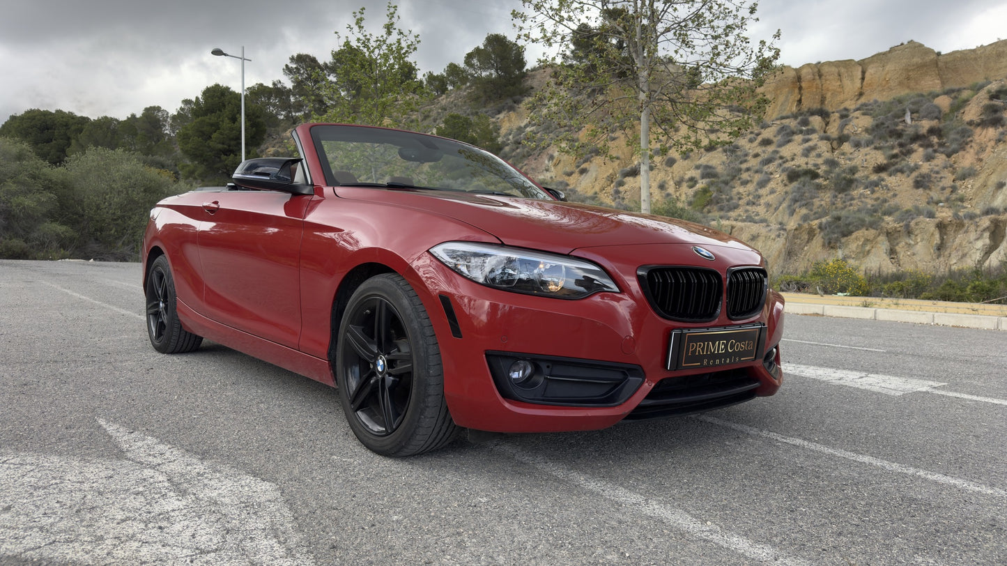 BMW 2 Series Cabrio parked in Benidorm, available for rent with delivery across Spain.