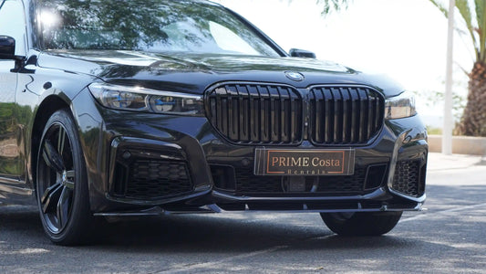 Black BMW 730D M Pack front view on street
