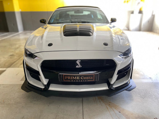 Ford Mustang convertible white front view with cobra badge