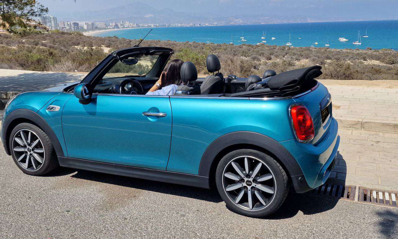 Mini Cooper Cabrio convertible for rent in Alicante β compact city car, stylish design, open-top driving.