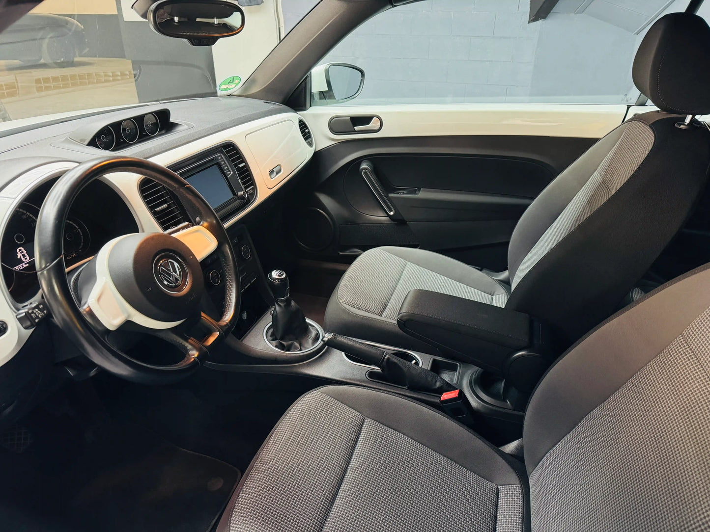 VW Beetle Kafer black interior view with visible dashboard and steering wheel