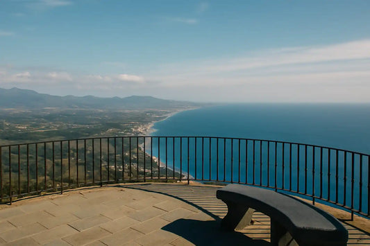 Panoramic viewpoint over Costa del Sol coastline with ocean and hills in the distance