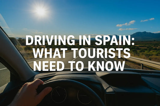 Driver's view of a Spanish highway at sunset, with hand on the steering wheel and mountain landscape in the background — perfect road trip vibes.