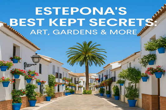 Colorful flower-lined street in Estepona’s old town, with whitewashed houses and a tall palm tree under clear blue skies — highlighting local art and charm.