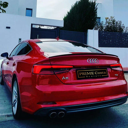 Red Audi A5 TDI S-Line for rent in Marbella – 2.0L diesel, automatic, stylish 5-seat limousine.