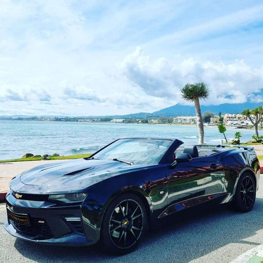 Black Chevrolet Camaro SS Cabrio for rent in Marbella – 6.2L V8 automatic convertible with 4 seats.

