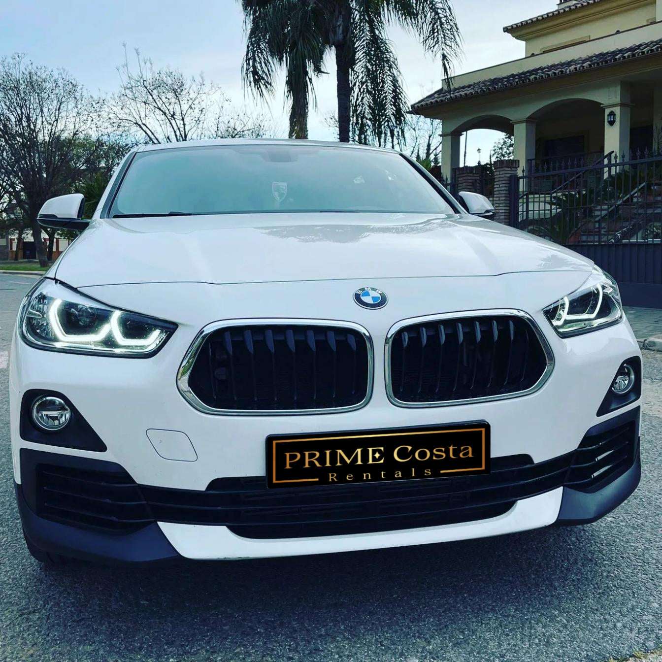 White BMW X2 SUV for rent in Marbella – automatic 4WD, 2.0L engine, compact 5-seater crossover.