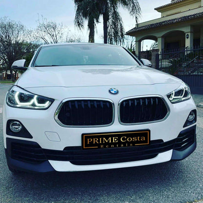 White BMW X2 SUV for rent in Marbella – automatic 4WD, 2.0L engine, compact 5-seater crossover.