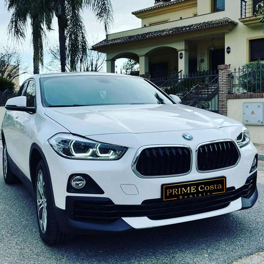 White BMW X2 SUV for rent in Marbella – automatic 4WD, 2.0L engine, compact 5-seater crossover.