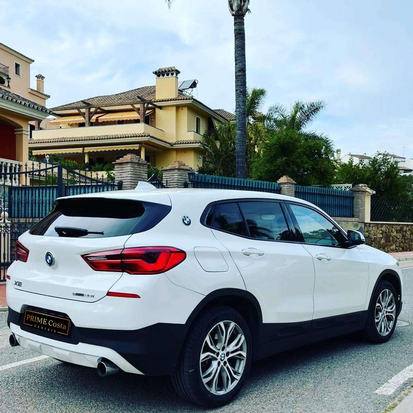White BMW X2 SUV for rent in Marbella – automatic 4WD, 2.0L engine, compact 5-seater crossover.