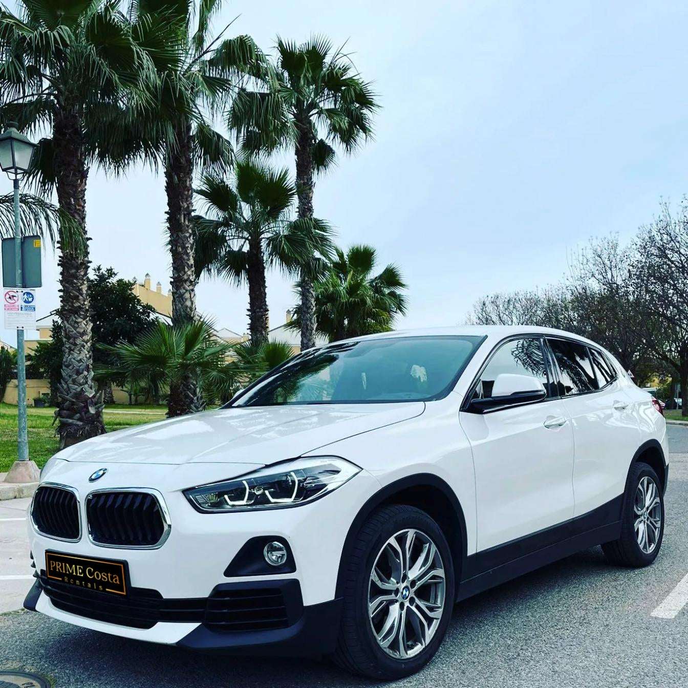 White BMW X2 SUV for rent in Marbella – automatic 4WD, 2.0L engine, compact 5-seater crossover.