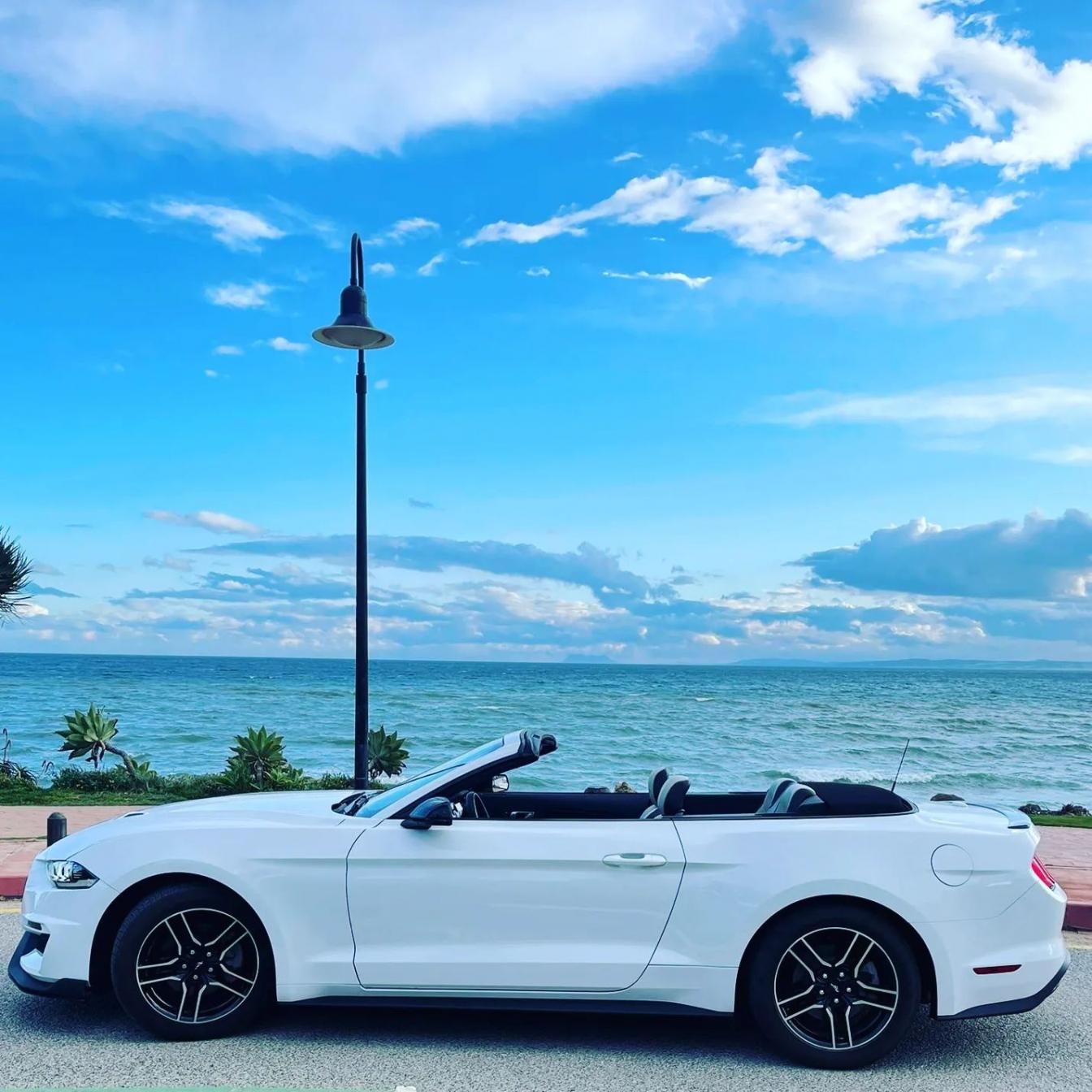 Ford Mustang Cabrio 2.3L turbo convertible for rent in Marbella – 350 HP, automatic, open-top driving.