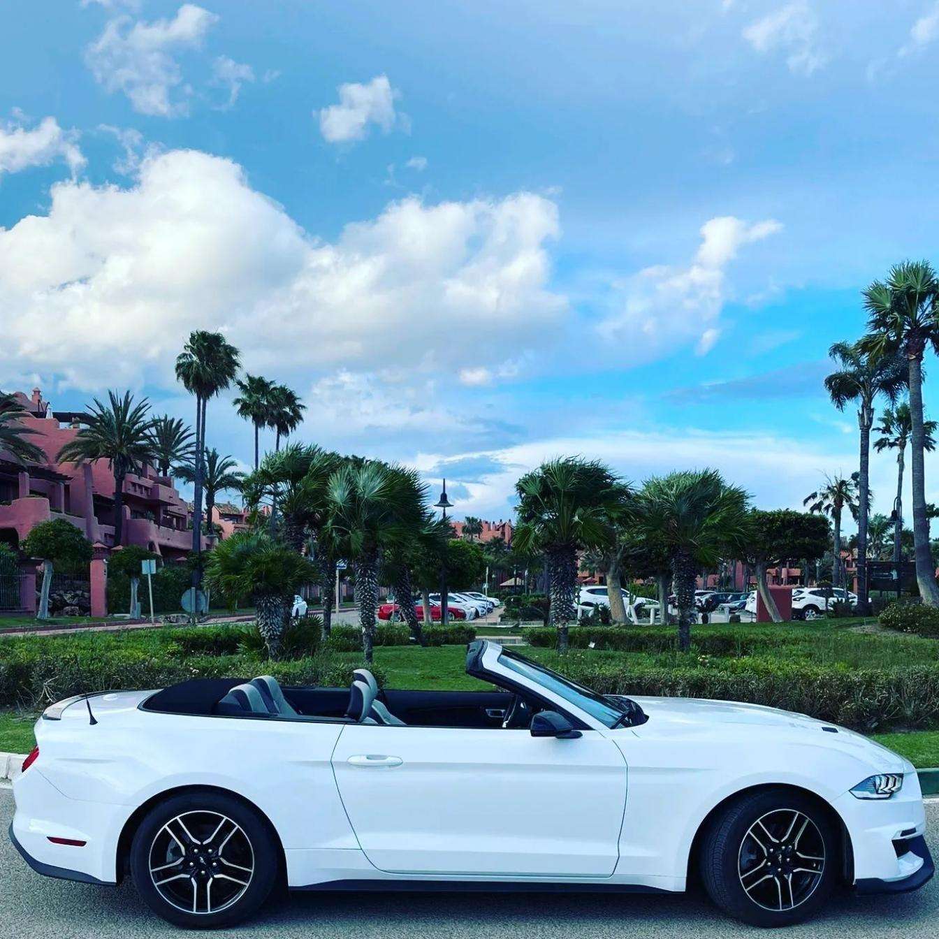 Ford Mustang Cabrio 2.3L turbo convertible for rent in Marbella – 350 HP, automatic, open-top driving.