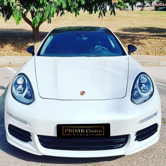 White Porsche Panamera 4 limousine for rent in Marbella – 3.6L engine, automatic 4WD luxury 4-seater.