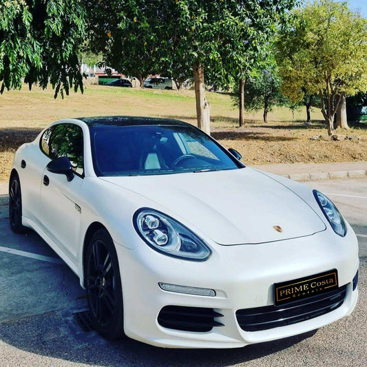 White Porsche Panamera 4 limousine for rent in Marbella – 3.6L engine, automatic 4WD luxury 4-seater.