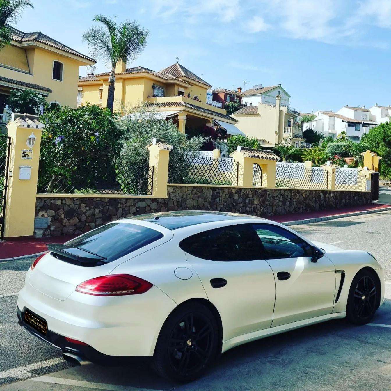 White Porsche Panamera 4 limousine for rent in Marbella – 3.6L engine, automatic 4WD luxury 4-seater.