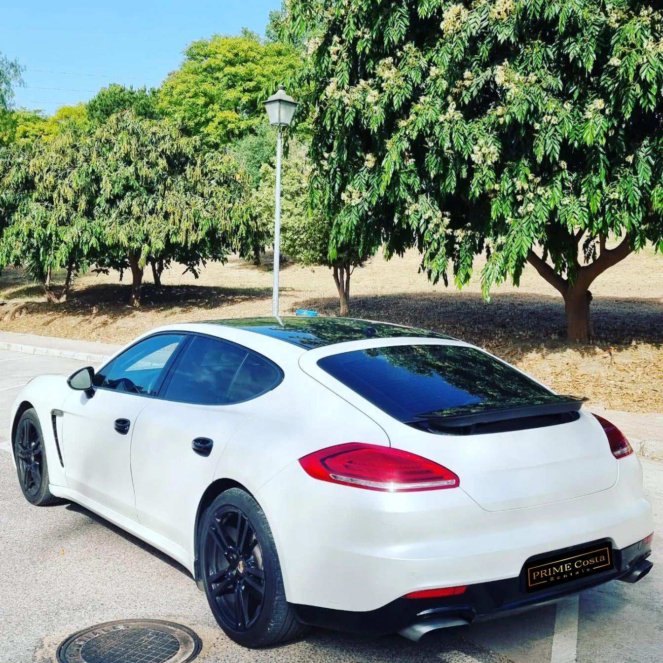 White Porsche Panamera 4 limousine for rent in Marbella – 3.6L engine, automatic 4WD luxury 4-seater.