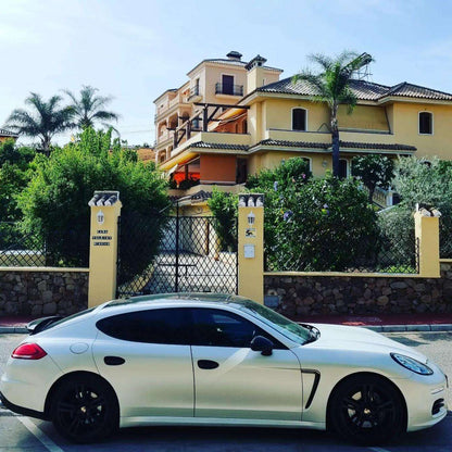 White Porsche Panamera 4 limousine for rent in Marbella – 3.6L engine, automatic 4WD luxury 4-seater.