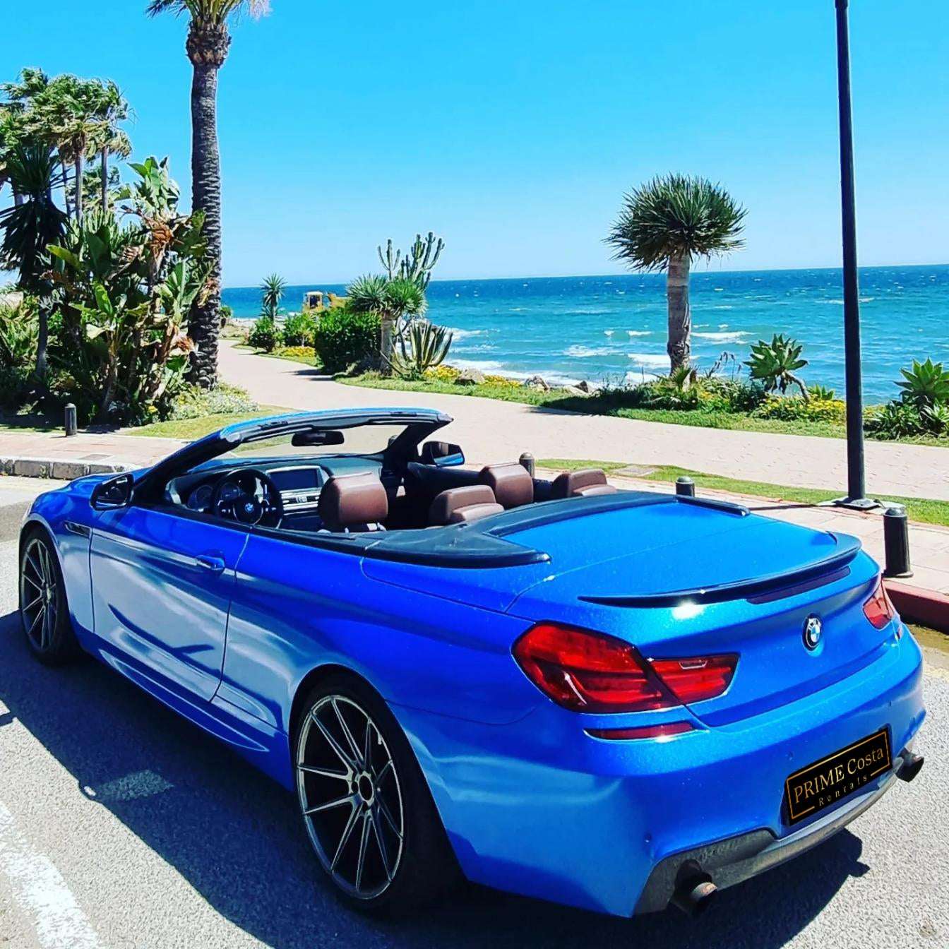 Blue BMW 640i Cabrio convertible for rent in Marbella – 3.0L automatic, 4 seats, luxury open-top driving.
