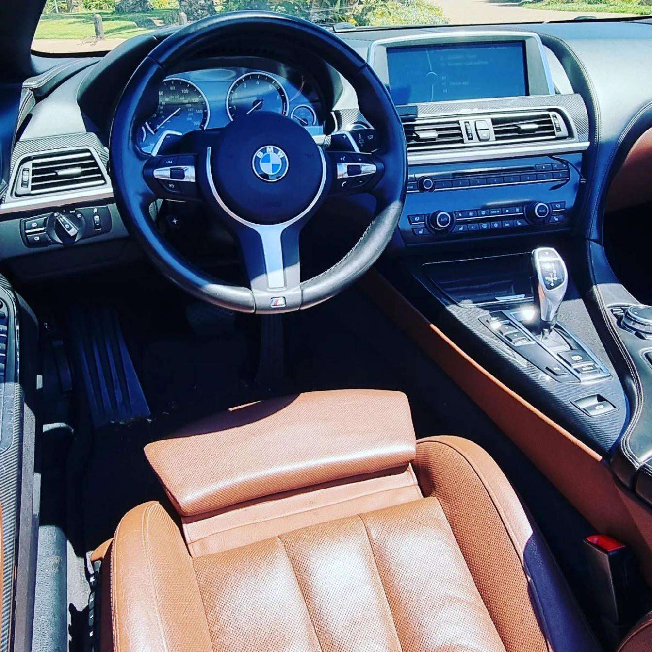 Blue BMW 640i Cabrio convertible for rent in Marbella – 3.0L automatic, 4 seats, luxury open-top driving.