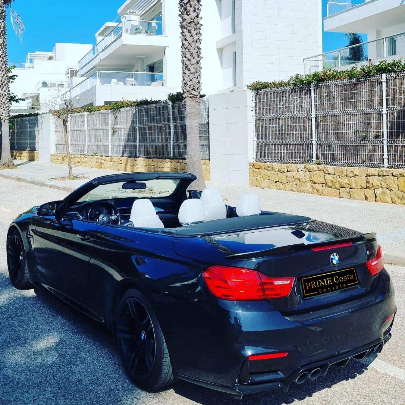 Black BMW M4 Cabrio for rent in Marbella – 425 HP convertible with 3.8s 0–100 km/h and top speed of 300 km/h.