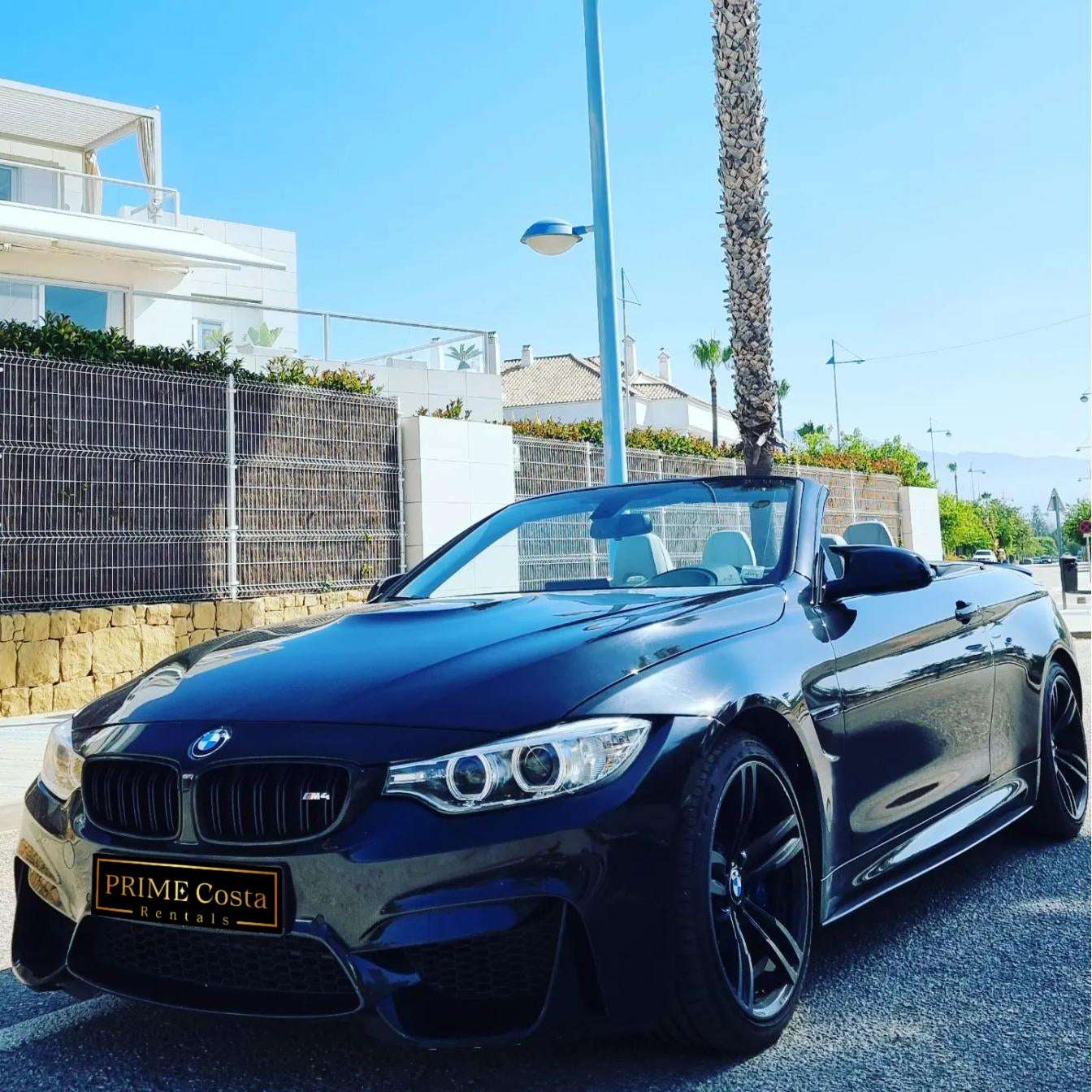 Black BMW M4 Cabrio for rent in Marbella – 425 HP convertible with 3.8s 0–100 km/h and top speed of 300 km/h.