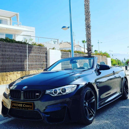 Black BMW M4 Cabrio for rent in Marbella – 425 HP convertible with 3.8s 0–100 km/h and top speed of 300 km/h.