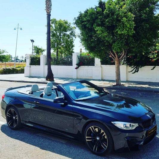 Black BMW M4 Cabrio for rent in Marbella – 425 HP convertible with 3.8s 0–100 km/h and top speed of 300 km/h.