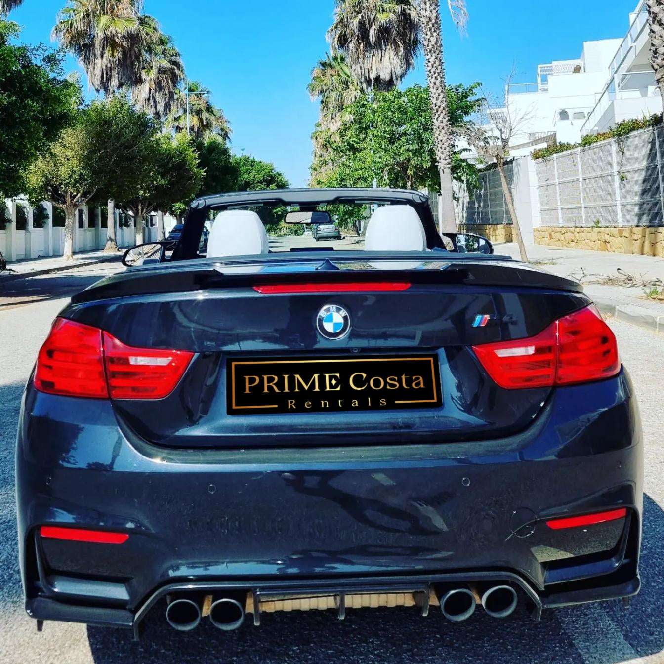Black BMW M4 Cabrio for rent in Marbella – 425 HP convertible with 3.8s 0–100 km/h and top speed of 300 km/h.