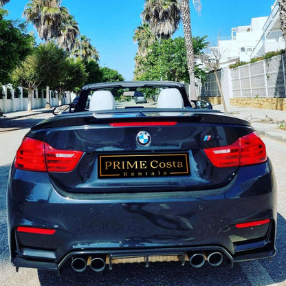 Black BMW M4 Cabrio for rent in Marbella – 425 HP convertible with 3.8s 0–100 km/h and top speed of 300 km/h.
