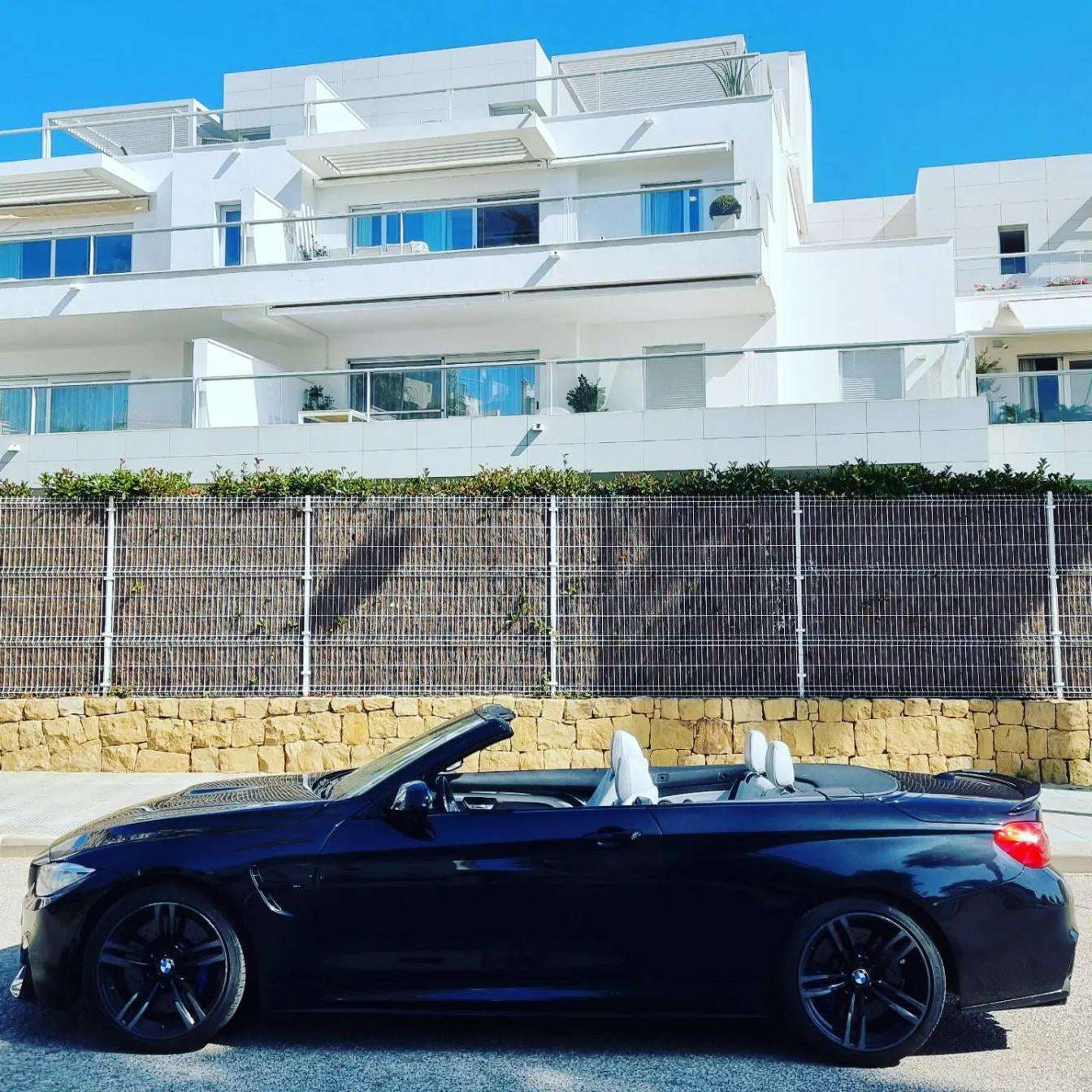 Black BMW M4 Cabrio for rent in Marbella – 425 HP convertible with 3.8s 0–100 km/h and top speed of 300 km/h.