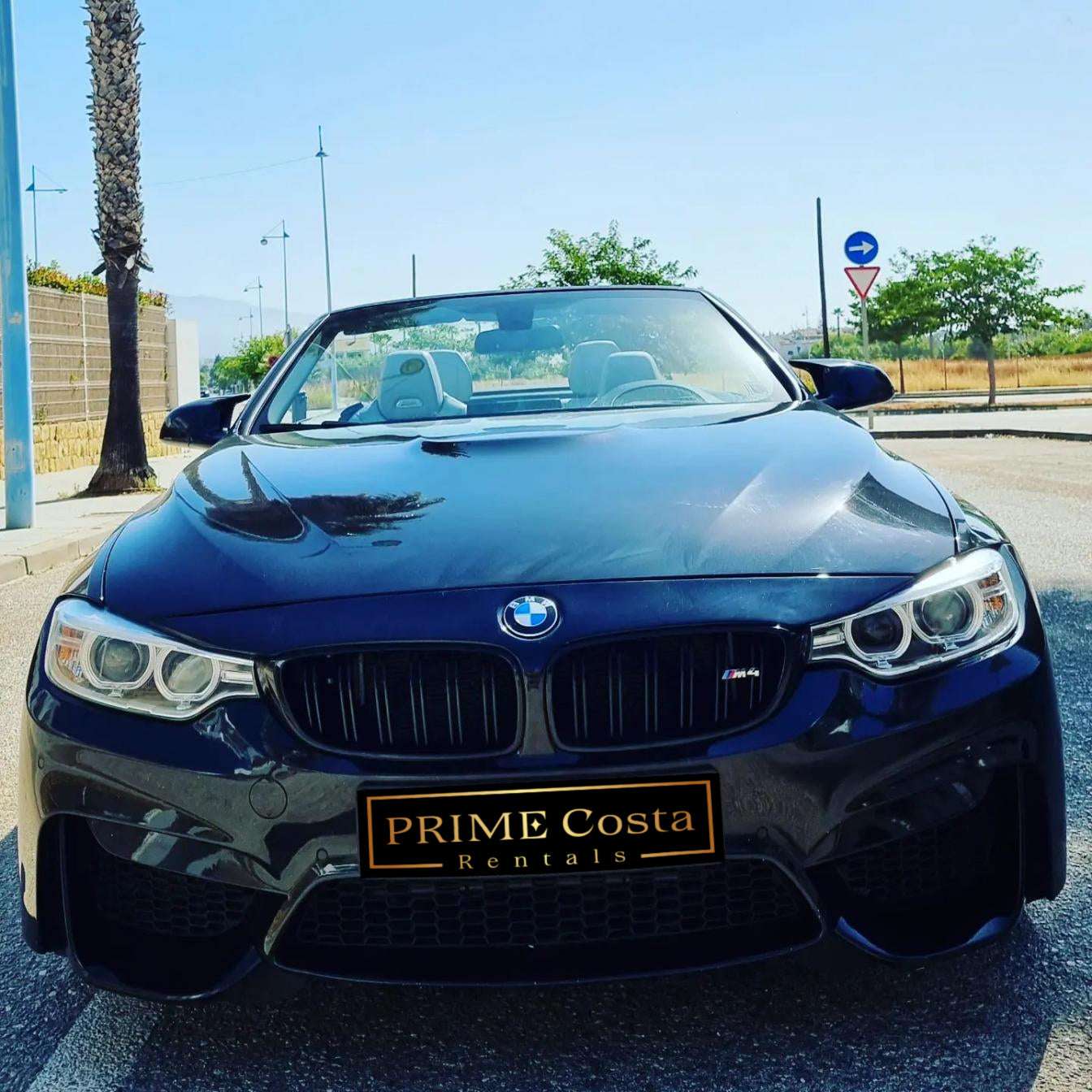 Black BMW M4 Cabrio for rent in Marbella – 425 HP convertible with 3.8s 0–100 km/h and top speed of 300 km/h.