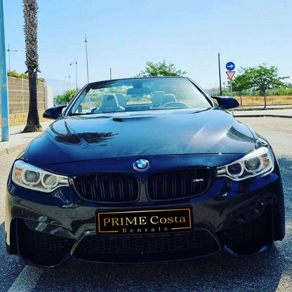 Black BMW M4 Cabrio for rent in Marbella – 425 HP convertible with 3.8s 0–100 km/h and top speed of 300 km/h.