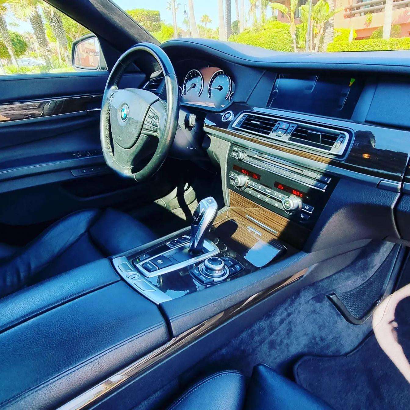 Black BMW 740Li limousine sedan for rent in Marbella – 3.0L automatic luxury car with seating for 5.