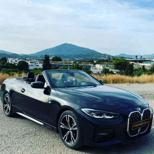 Grey BMW 420M Cabrio convertible for rent in Marbella – 4-seater automatic with sporty design and open-top driving experience.