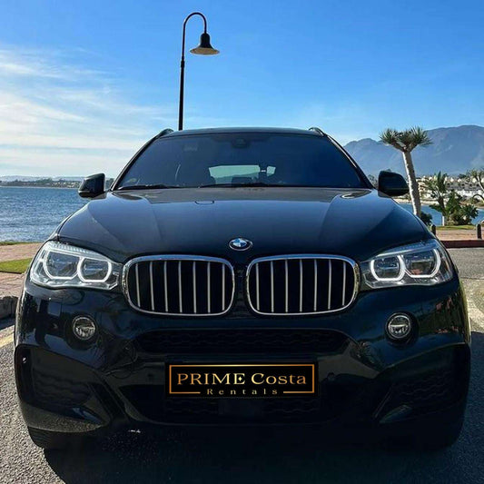 Black BMW X6 SUV for rent in Marbella – automatic, luxury 5-seater with a bold and sporty design.